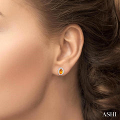 5x3 MM Oval Shape Citrine and 1/8 Ctw Round Cut Diamond Halo Semi-Precious Stud Earrings in 10K White Gold