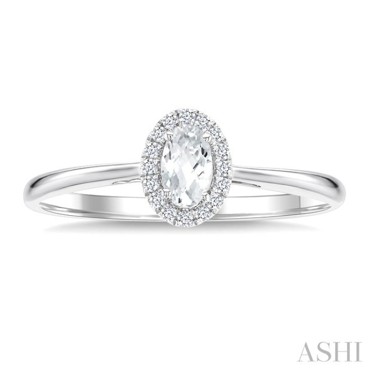 5x3 MM Oval Shape White Topaz and 1/20 Ctw Round Cut Diamond Halo Semi-Precious Ring in 14K White Gold