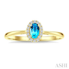 5x3 MM Oval Shape Blue Topaz and 1/20 Ctw Round Cut Diamond Halo Semi-Precious Ring in 14K Yellow Gold
