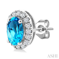 5x3 MM Oval Shape Blue Topaz and 1/8 Ctw Round Cut Diamond Halo Semi-Precious Stud Earrings in 10K White Gold