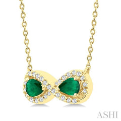 4X3 MM Pear Shape Emerald and 1/10 Ctw Round Cut Diamond Precious Infinite Halo Pendant With Chain in 10K Yellow Gold