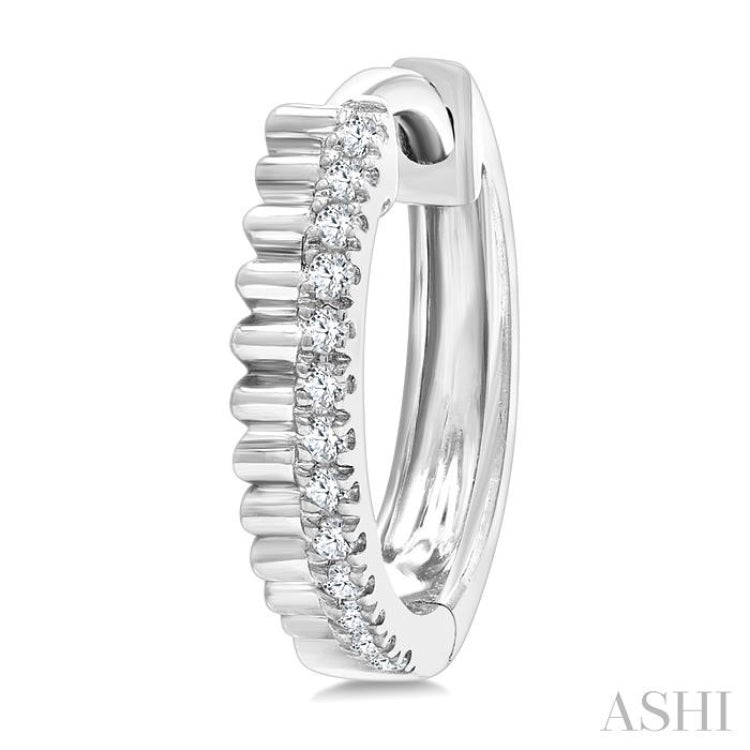 1/10 Ctw Fluted Round Cut Diamond Petite Huggie Earrings in 10K White Gold