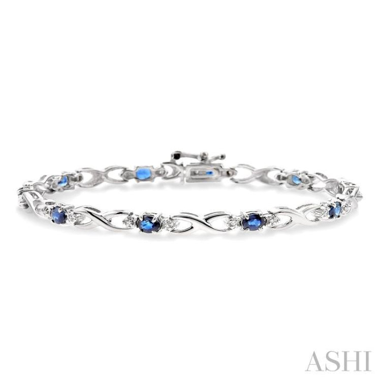 4x3 MM Oval Cut Sapphire and 1/10 Ctw Round Cut Diamond Bracelet in 14K White Gold