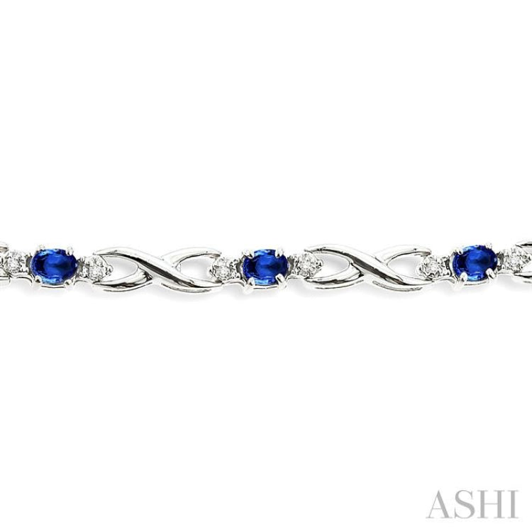 4x3 MM Oval Cut Sapphire and 1/10 Ctw Round Cut Diamond Bracelet in 14K White Gold