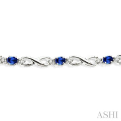 4x3 MM Oval Cut Sapphire and 1/10 Ctw Round Cut Diamond Bracelet in 14K White Gold