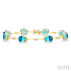 8x6 MM Oval Shape Blue Topaz and 1/4 Ctw Round Cut Diamond Semi-Precious Bracelet in 10K Yellow Gold