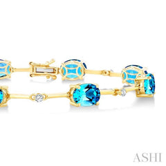 8x6 MM Oval Shape Blue Topaz and 1/4 Ctw Round Cut Diamond Semi-Precious Bracelet in 10K Yellow Gold