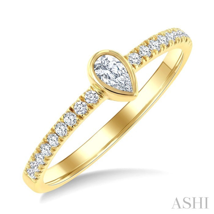 1/3 Ctw Bezel Set Pear and Round Cut Diamond Fashion Ring in 14K Yellow Gold