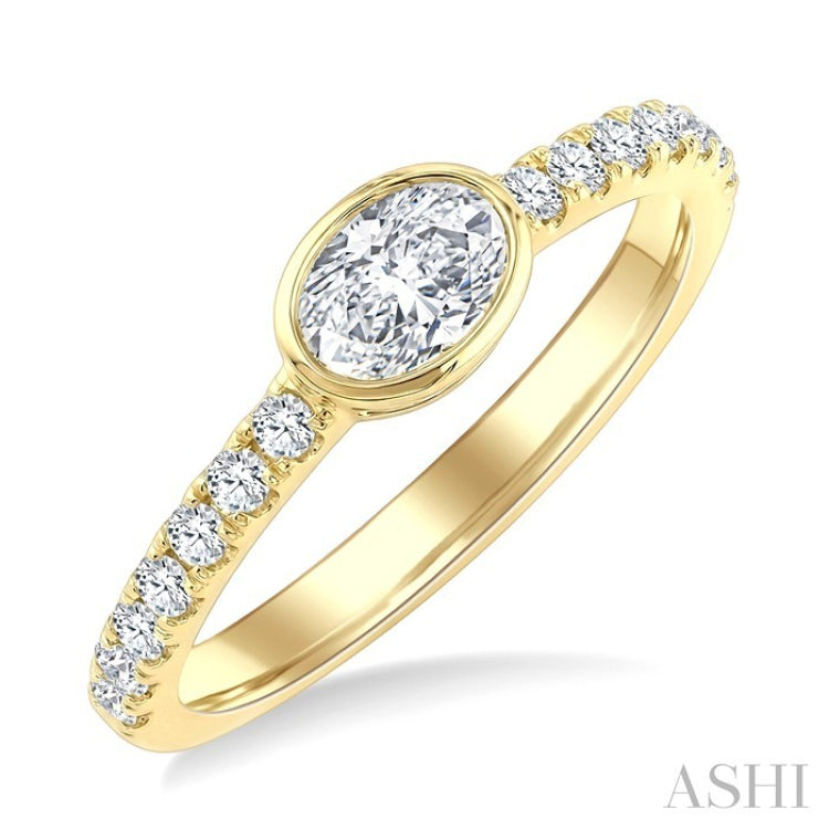 1/2 Ctw East-West Oval Cut and Round Cut Diamond Ring in 14K Yellow Gold