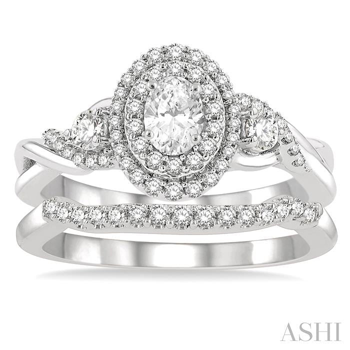 3/4 Ctw Round Cut Diamond Wedding Set With 5/8 Ct Split Shank Oval Cut Center Stone Engagement Ring and 1/8 Ct Wedding Band in 14K White Gold
