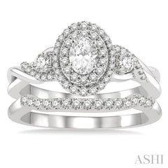 3/4 Ctw Round Cut Diamond Wedding Set With 5/8 Ct Split Shank Oval Cut Center Stone Engagement Ring and 1/8 Ct Wedding Band in 14K White Gold