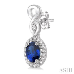 5x3 MM Oval Cut Sapphire and 1/6 Ctw Round Cut Diamond Earrings in 14K White Gold