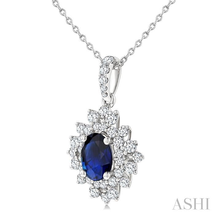 7x5 MM Oval Cut Sapphire and 1/2 Ctw Round Cut Diamond Halo Precious Pendant With Chain in 14K White Gold