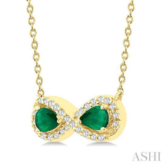 4X3 MM Pear Shape Emerald and 1/10 Ctw Round Cut Diamond Precious Infinite Halo Pendant With Chain in 10K Yellow Gold