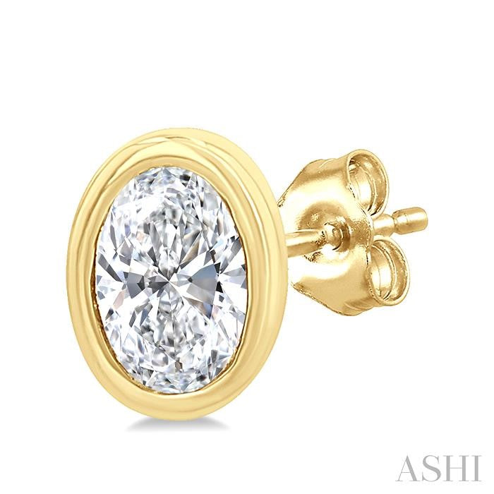 1/5 Ctw Petite Bezel Set Oval Cut Diamond Fashion Stud Earring in 10K Yellow Gold