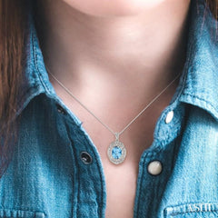 9x7 MM Oval Cut Blue Topaz and 1/50 Ctw Round Cut Diamond Pendant in Sterling Silver with Chain