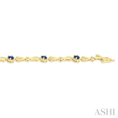 4X3 MM Oval Cut Sapphire 1/10 Ctw and Round Cut Diamond Precious Bracelet in 10K Yellow Gold
