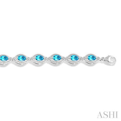 6x4 MM Oval Cut Blue Topaz and 1/10 Ctw Round Cut Diamond Semi-Precious Bracelet in Sterling Silver