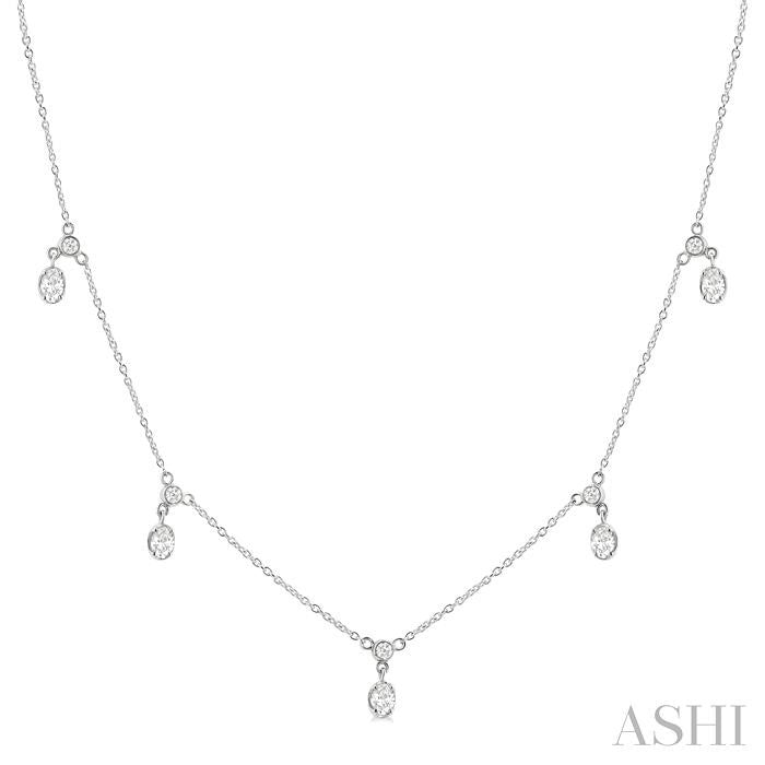5/8 Ctw Dangle Oval and Round Cut Diamond Station Necklace in 14K White Gold