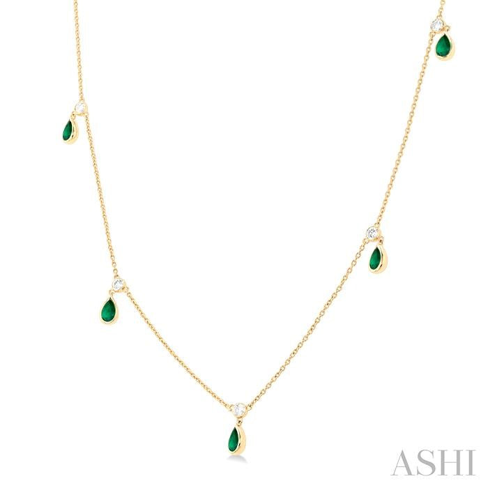 5x3 MM Pear Shape Emerald and 1/8 Ctw Round Cut Diamonds Precious Station Necklace in 10K Yellow Gold