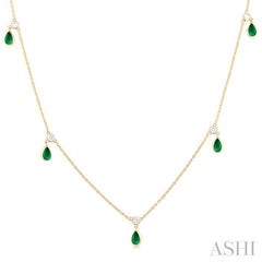 5x3 MM Pear Shape Emerald and 1/8 Ctw Round Cut Diamonds Precious Station Necklace in 10K Yellow Gold