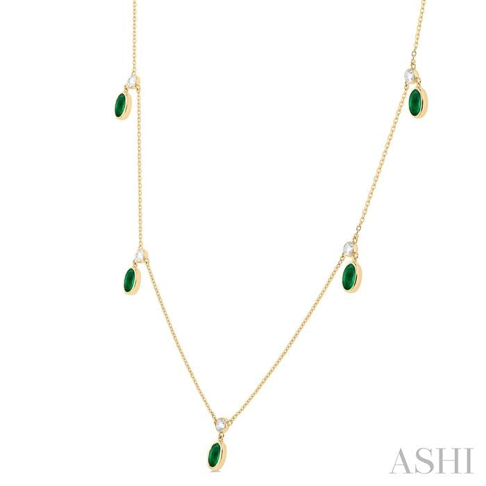 5x3 MM Oval Shape Emerald and 1/4 Ctw Round Cut Diamonds Precious Station Necklace in 10K Yellow Gold