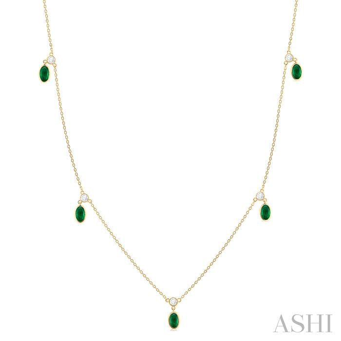 5x3 MM Oval Shape Emerald and 1/4 Ctw Round Cut Diamonds Precious Station Necklace in 10K Yellow Gold