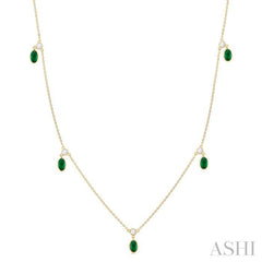 5x3 MM Oval Shape Emerald and 1/4 Ctw Round Cut Diamonds Precious Station Necklace in 10K Yellow Gold